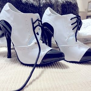 Women’s white and black dressy bootie style heels